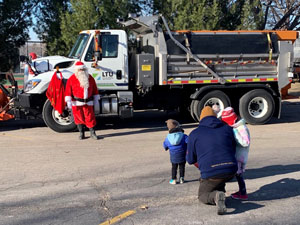Santa waving from truck