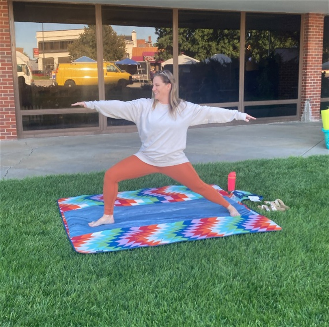 woman performing yoga pose outside