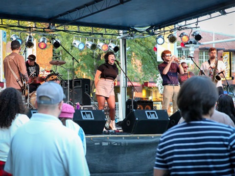 Photograph of band playing downtown event